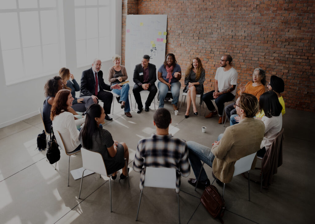 People in a discussion seated in a circle